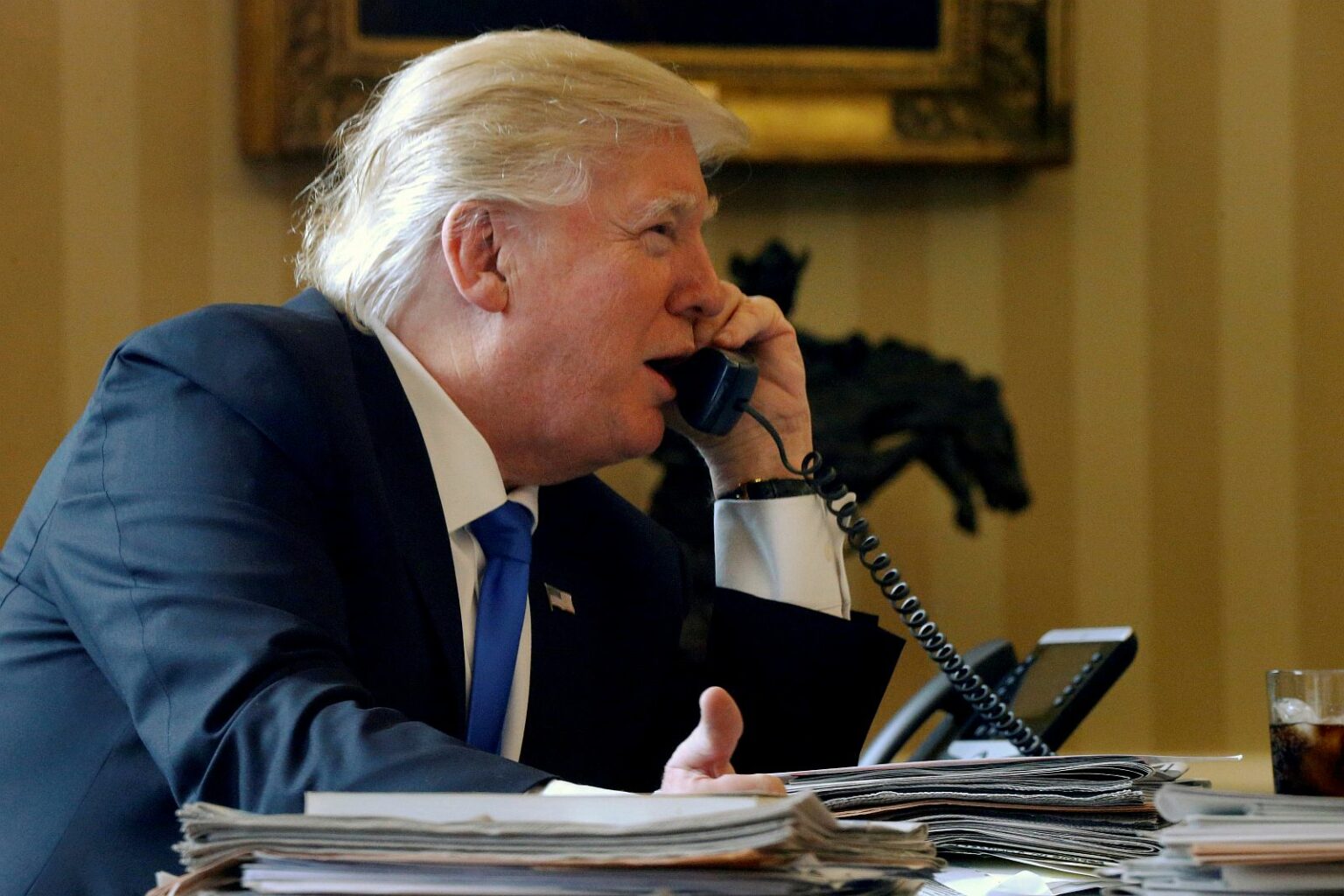 U.S. President Donald Trump speaks by phone with Russia's President Vladimir Putin in the Oval Office at the White House in Washington, U.S. January 28, 2017.