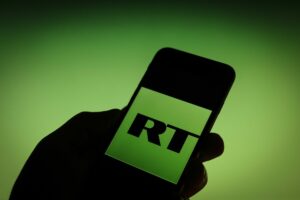RT has become one of tools for spreading the Russian fake news. The Russia Today logo is seen on a iPhone in this photo illustration.