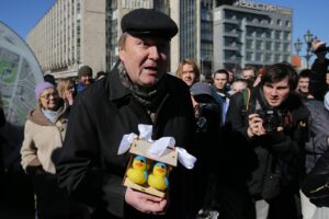 A man holds yellow rubber ducks as he takes part in Russian opposition activist Alexei Navalny's anti-corruption rally in Pushkin Square. The event has not been authorized by the Moscow Government.