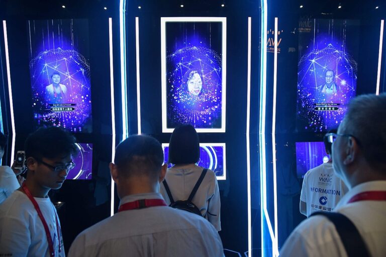 People have their faces scanned as they arrive for the opening ceremony of the World Artificial Intelligence Conference (WAIC) in Shanghai in August 2019. The United States is leading rivals in development and use of artificial intelligence while China is rising quickly and the European Union is lagging.